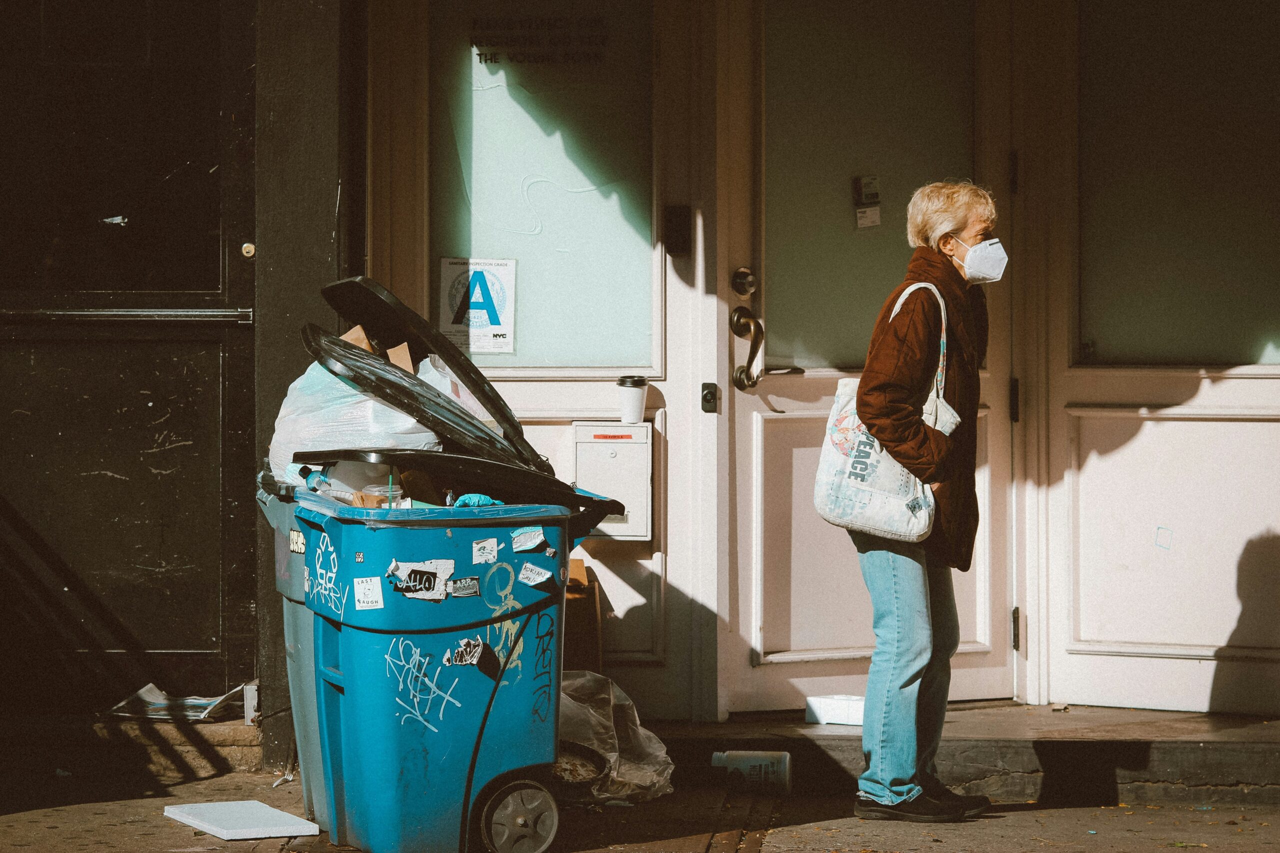 Professionals wearing hazmat suits removing asbestos safely from a home.