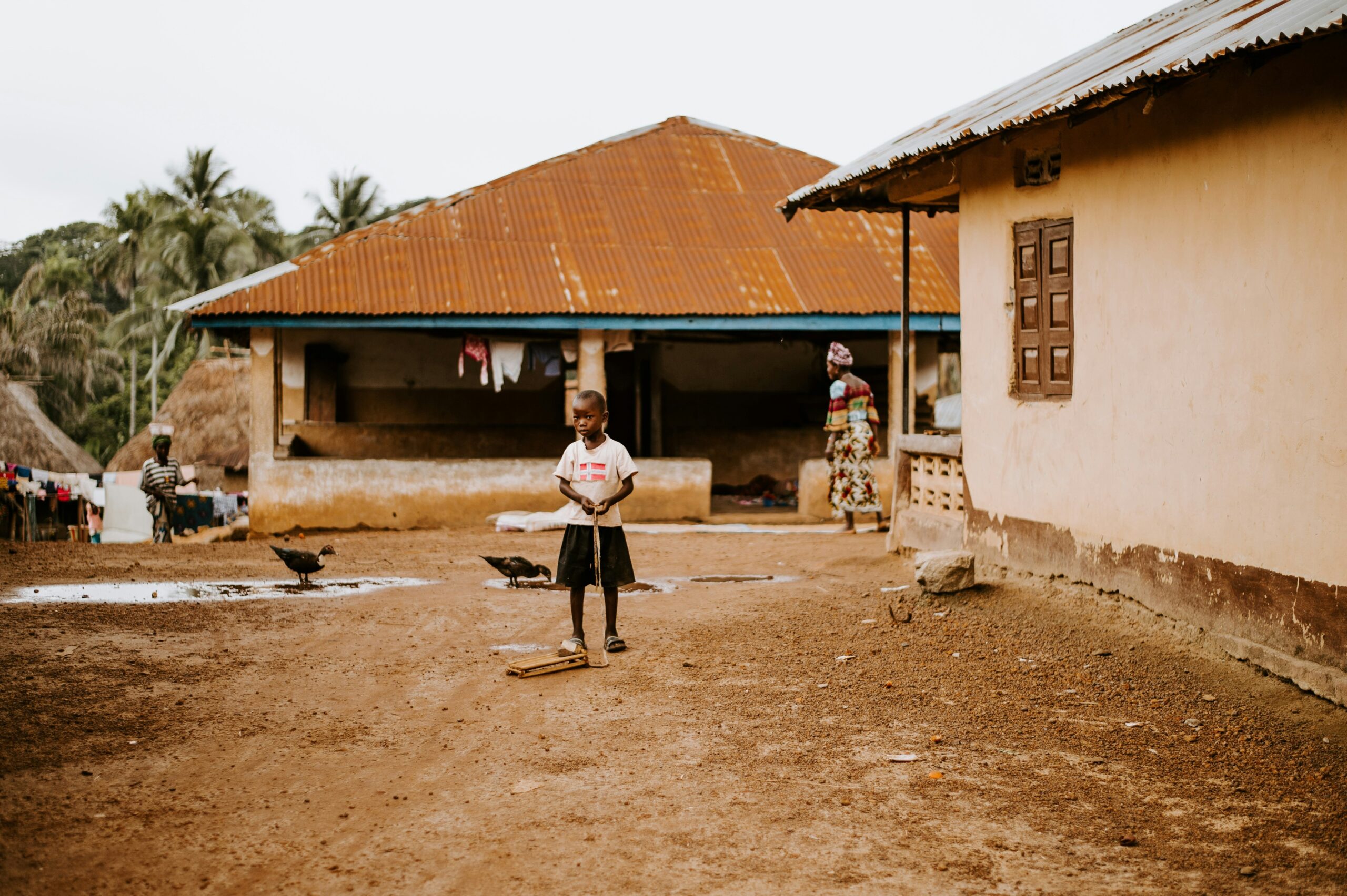 Family standing proudly outside newly renovated home