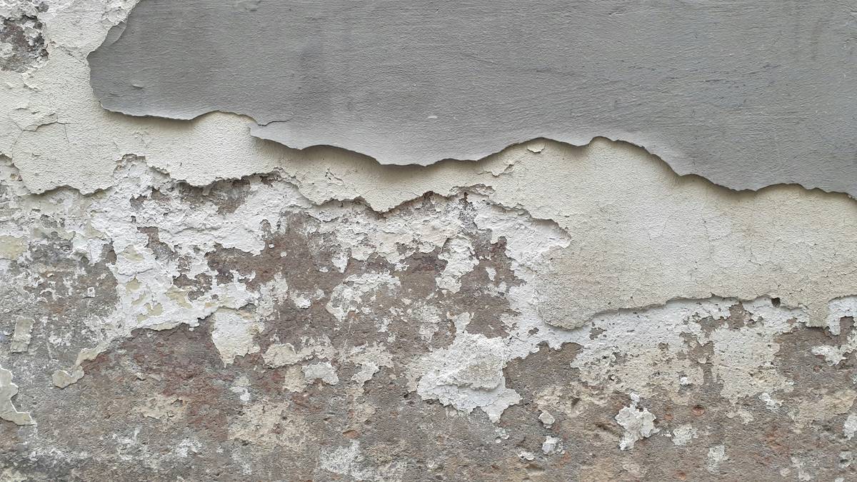 Photo of John standing next to his newly renovated attic post-asbestos cleanup