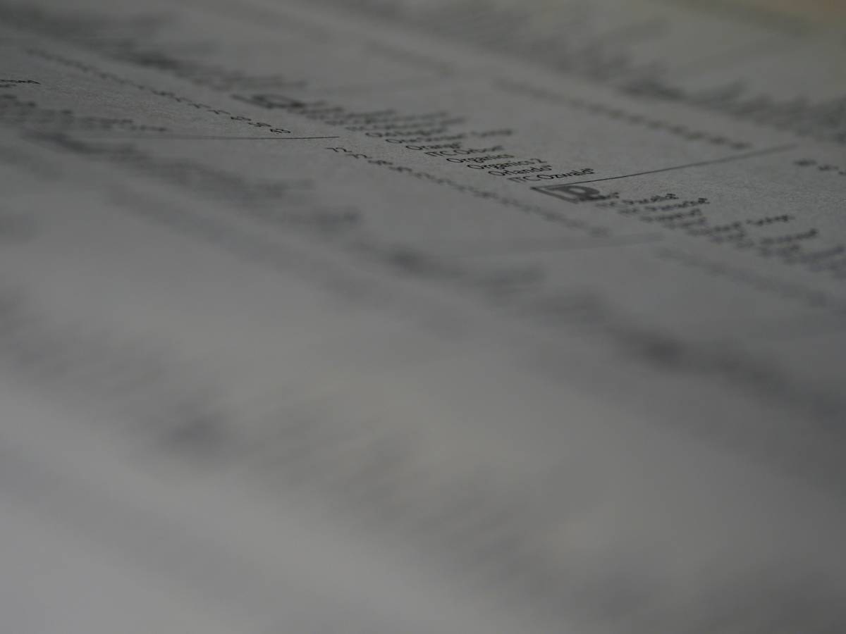 Photo of John smiling outside his restored asbestos-free house.
